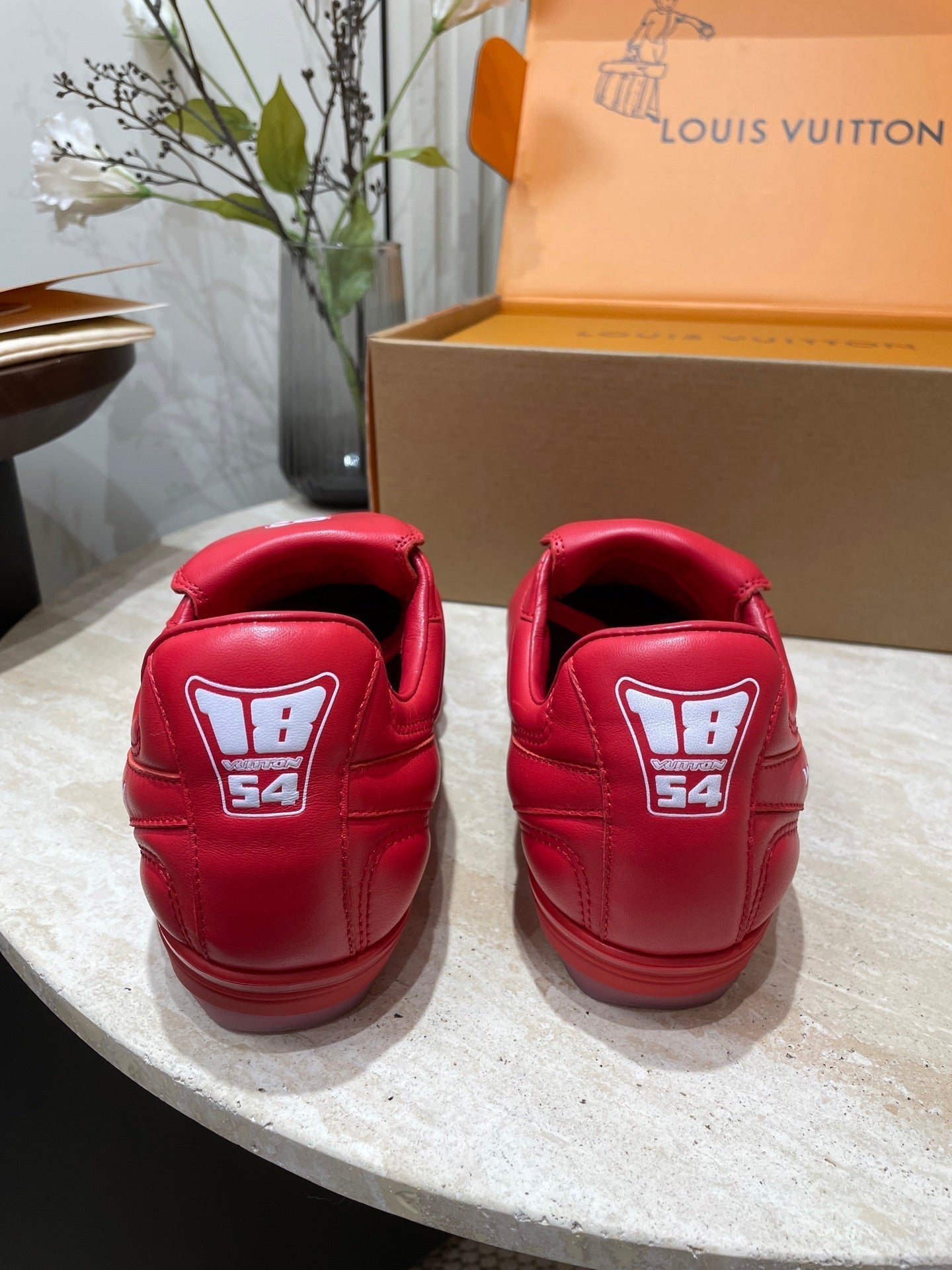 LOUIS VUITTON FOOTPRINT SOCCER SNEAKER IN CHERRY RED CALFSKIN